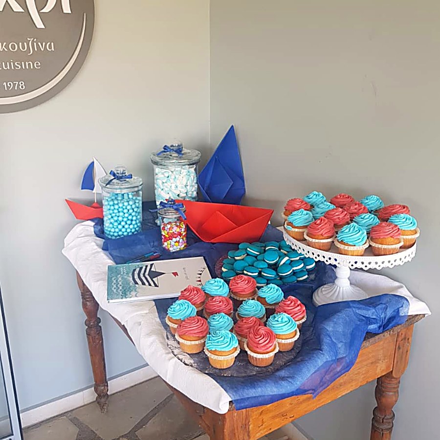 A christening dessert table at Kri Kri with cupcakes and a nautical theme