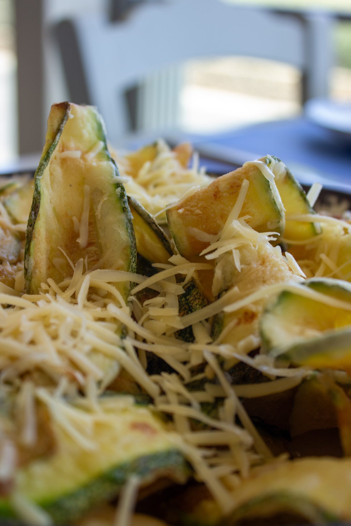 Fried zucchini with grated cheese