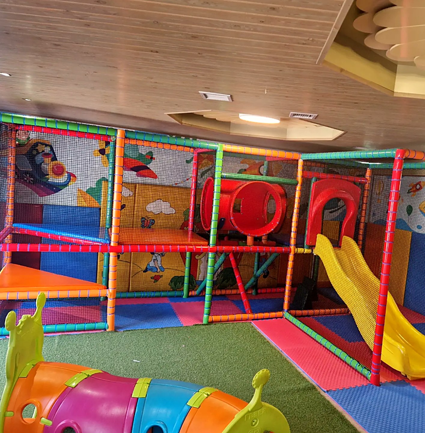 The children's playroom with slides and painted walls