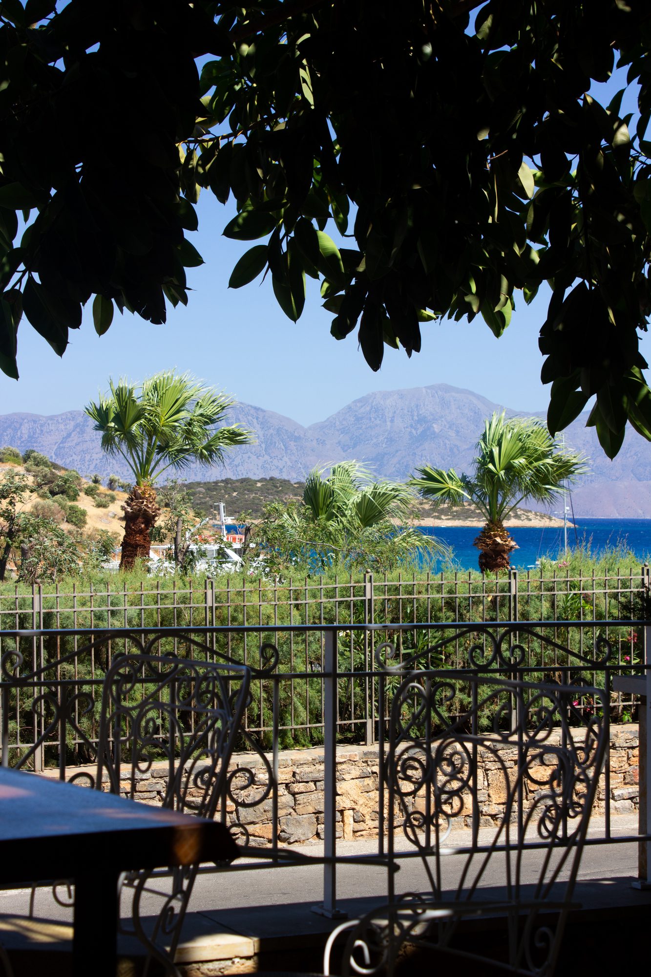 The bay and mountains seen over the terrace railing